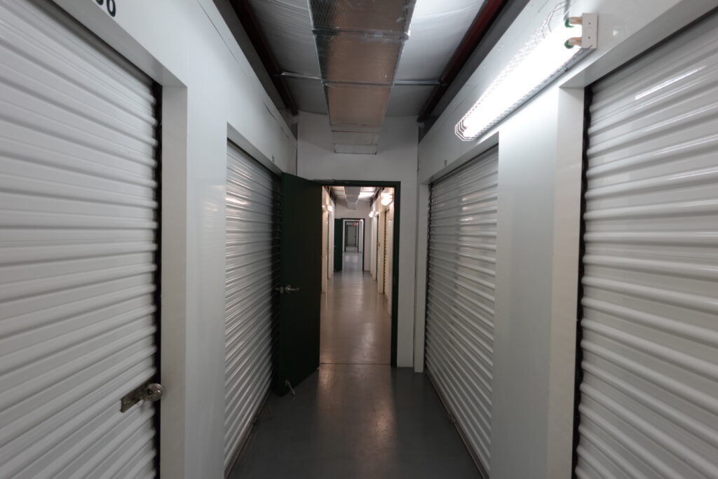 Photo depicts the interior hallway showcasing our well lit facility, security and climate control