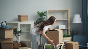 Woman packing boxes to bring to her self storage unit at The Storage House FL